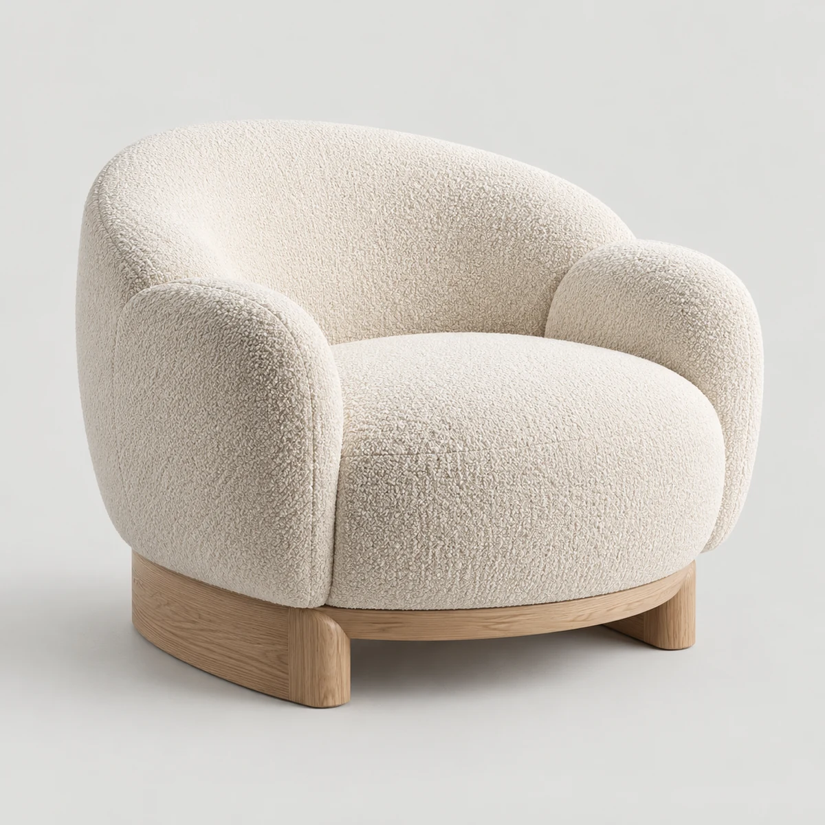 Ivory bouclé lounge chair with a pale oak base on a light gray background